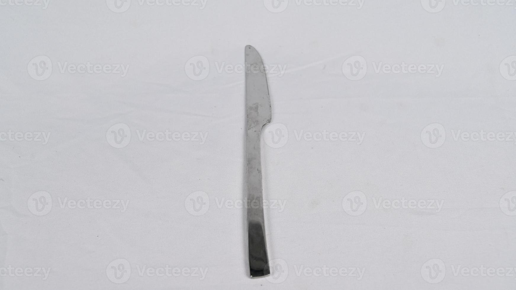 Stainless steel kitchen glossy metal knife isolated over the white background photo