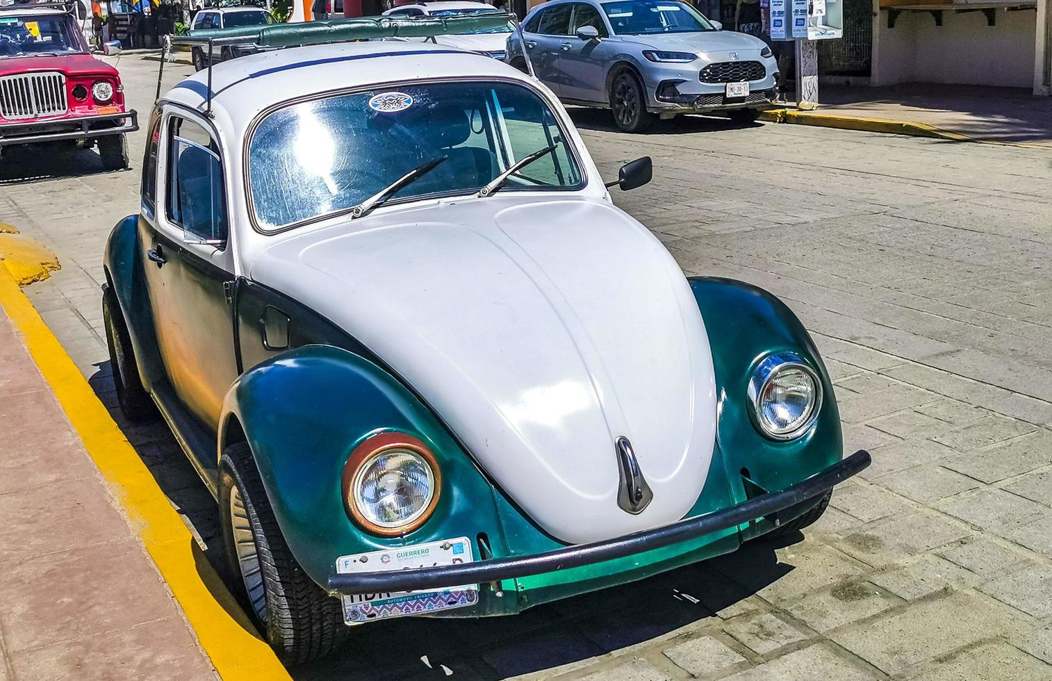 Puerto Escondido Oaxaca Mexico 2022 Various colorful tuned cars and classic vintage cars  Mexico. photo