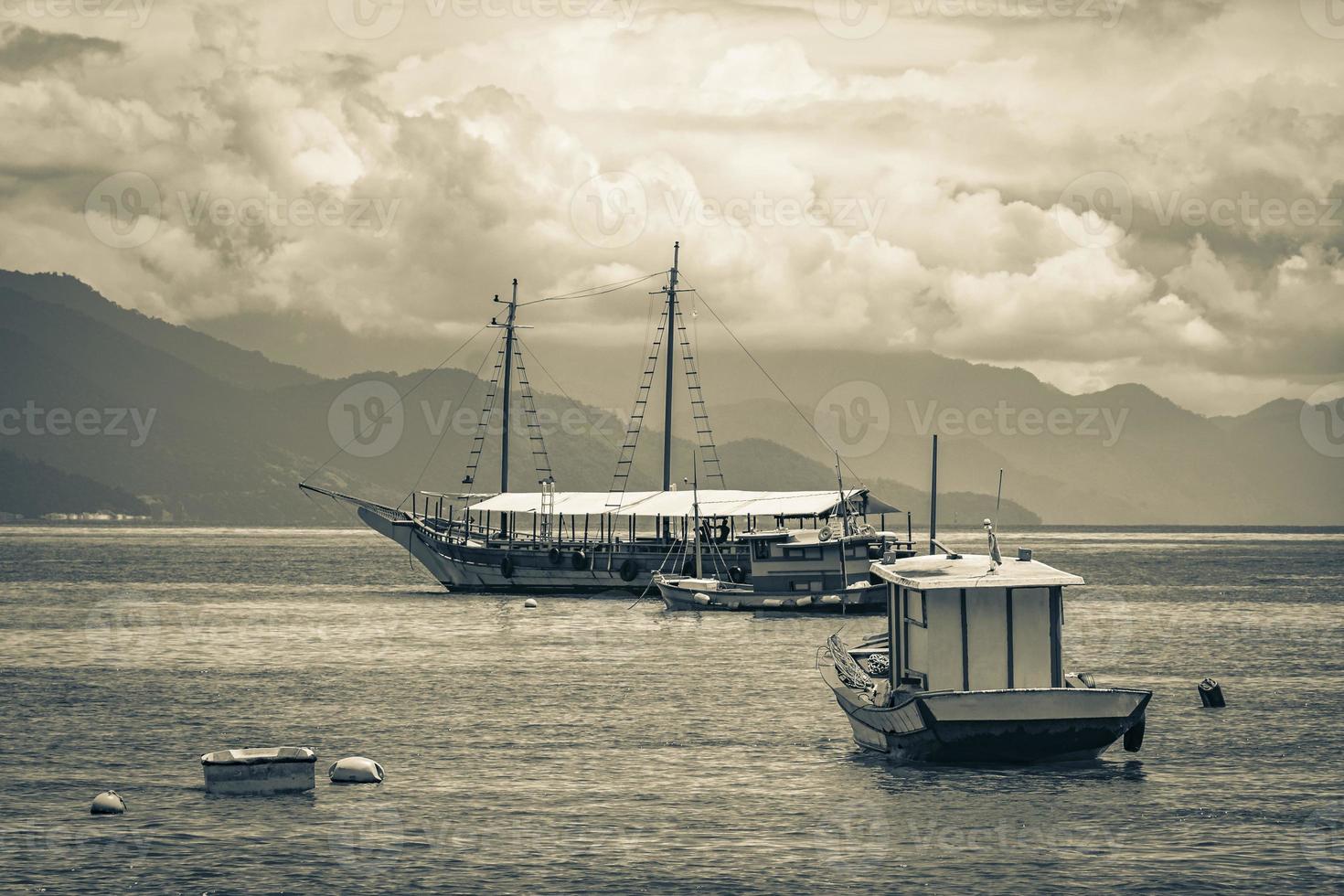 Boats ships and Boat trips Abraao beach Ilha Grande Brazil. photo