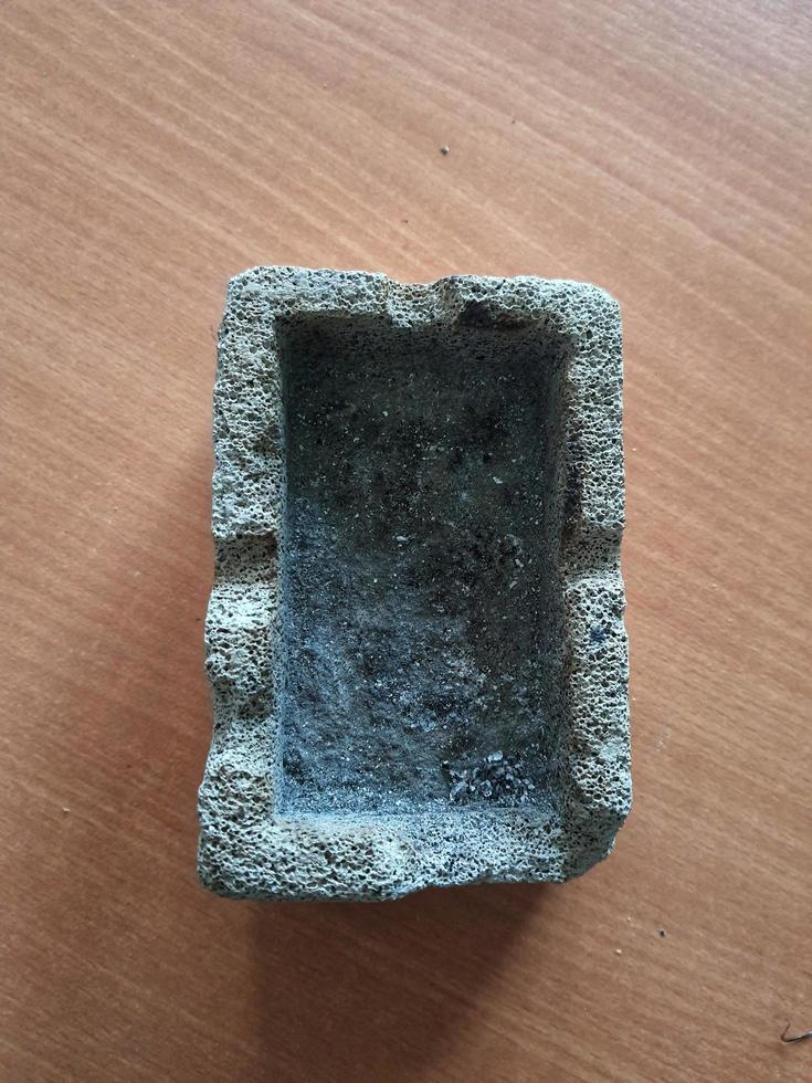 This is a photo of a traditional ashtray. This ashtray is made of pumice.