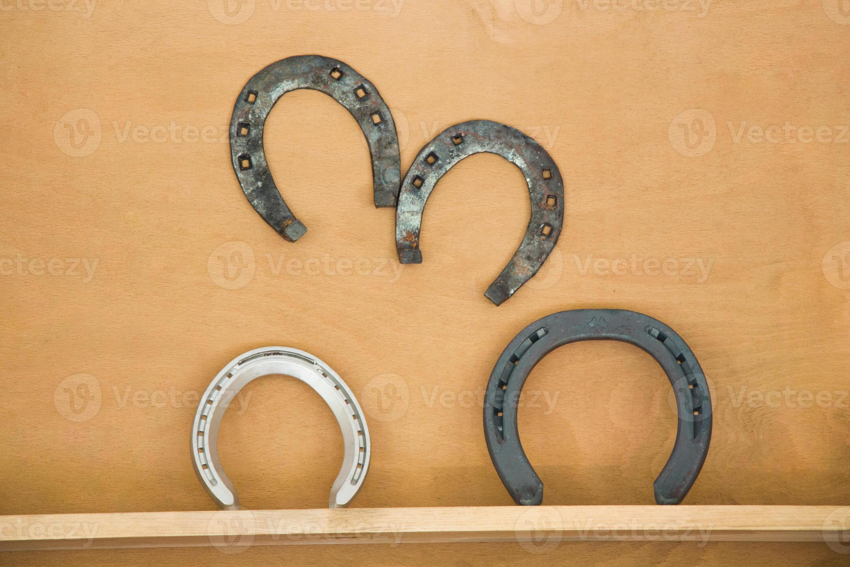 Lucky horseshoes with nail holes 15086075 Stock Photo at Vecteezy
