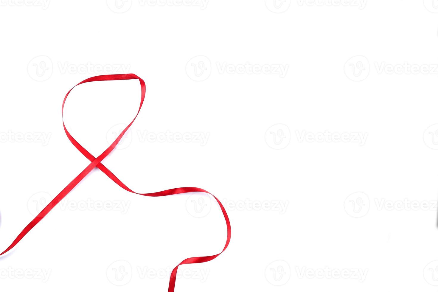 Red Support Ribbon isolated on white background. World aids day and national HIV AIDS and aging awareness month with red ribbon. copyspace area photo