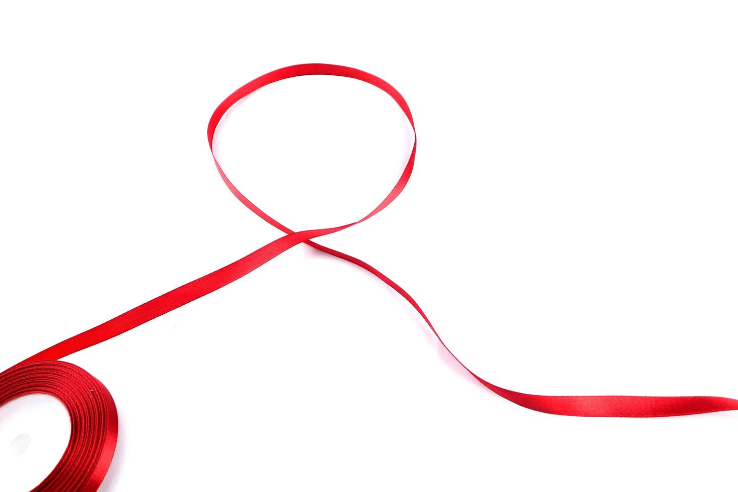 Red Support Ribbon isolated on white background. World aids day and national HIV AIDS and aging awareness month with red ribbon. copyspace area photo