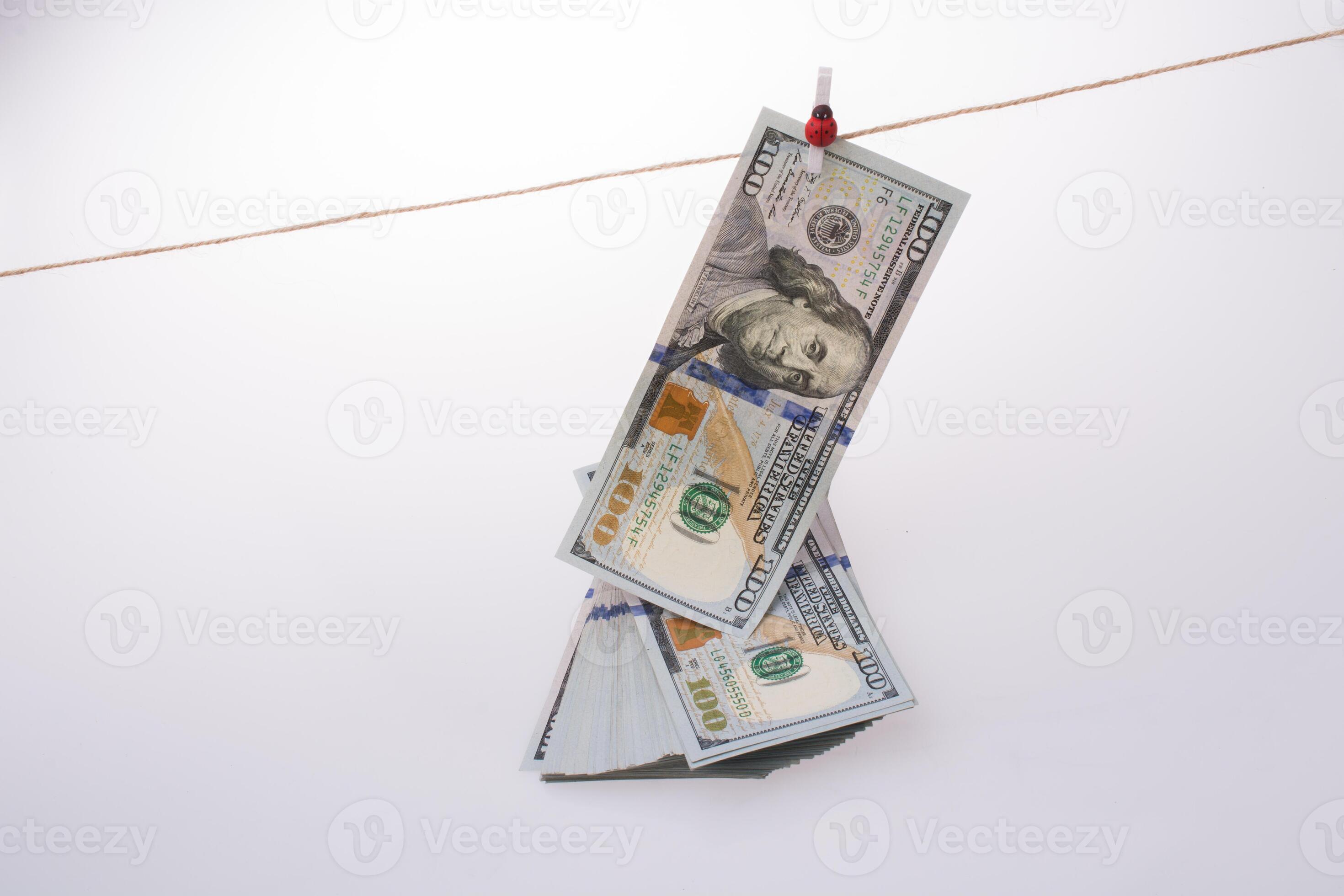 Banknote of US dollar hanging on a string 15118223 Stock Photo at Vecteezy