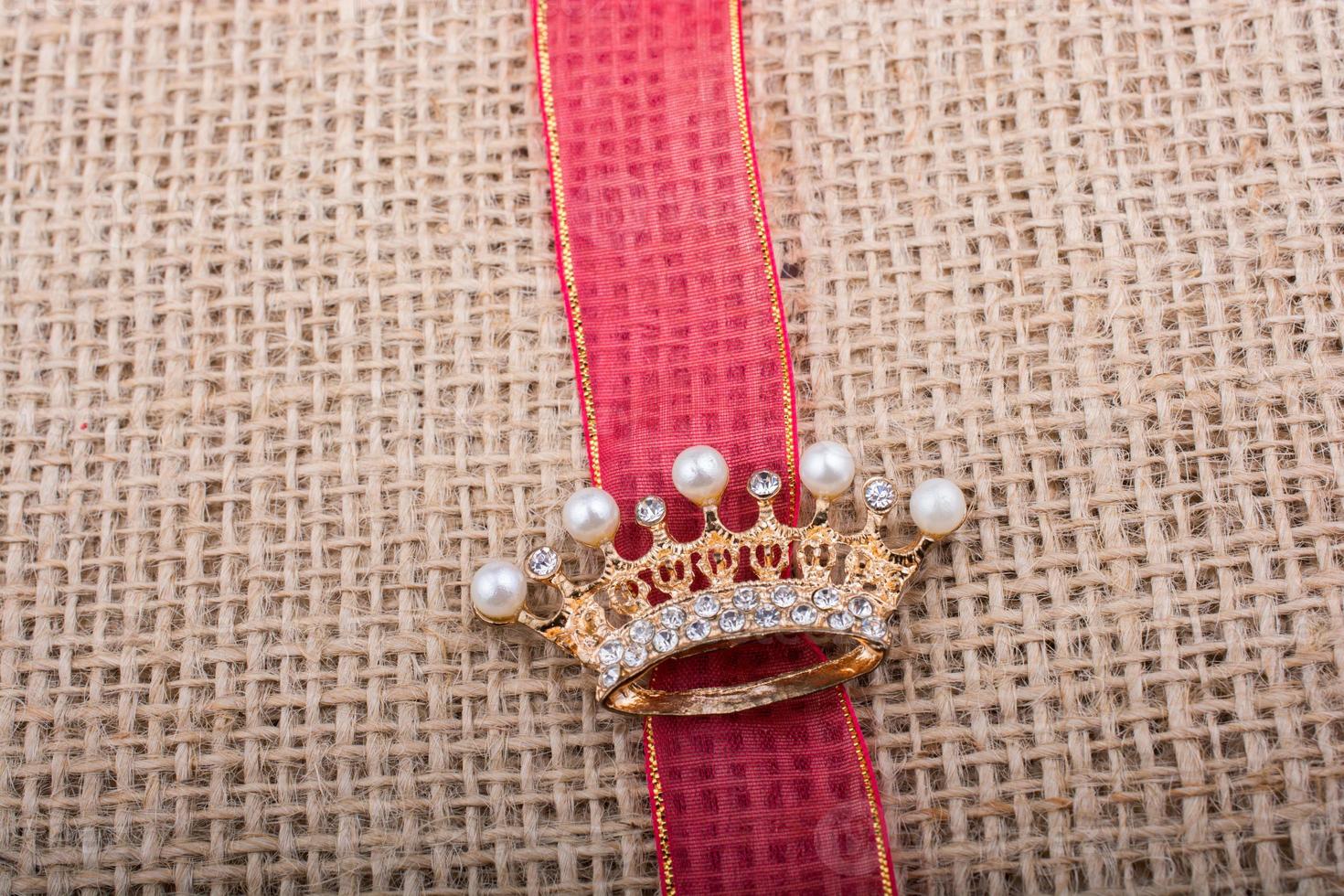 Model crown placed on a band on canvas photo