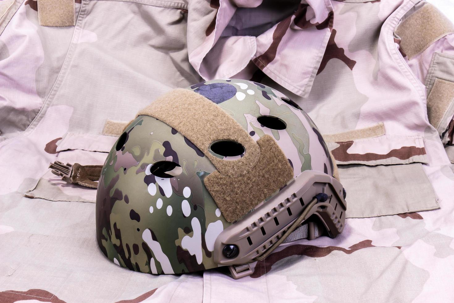 Military Helmet On  Desert Camouflage Shirt photo