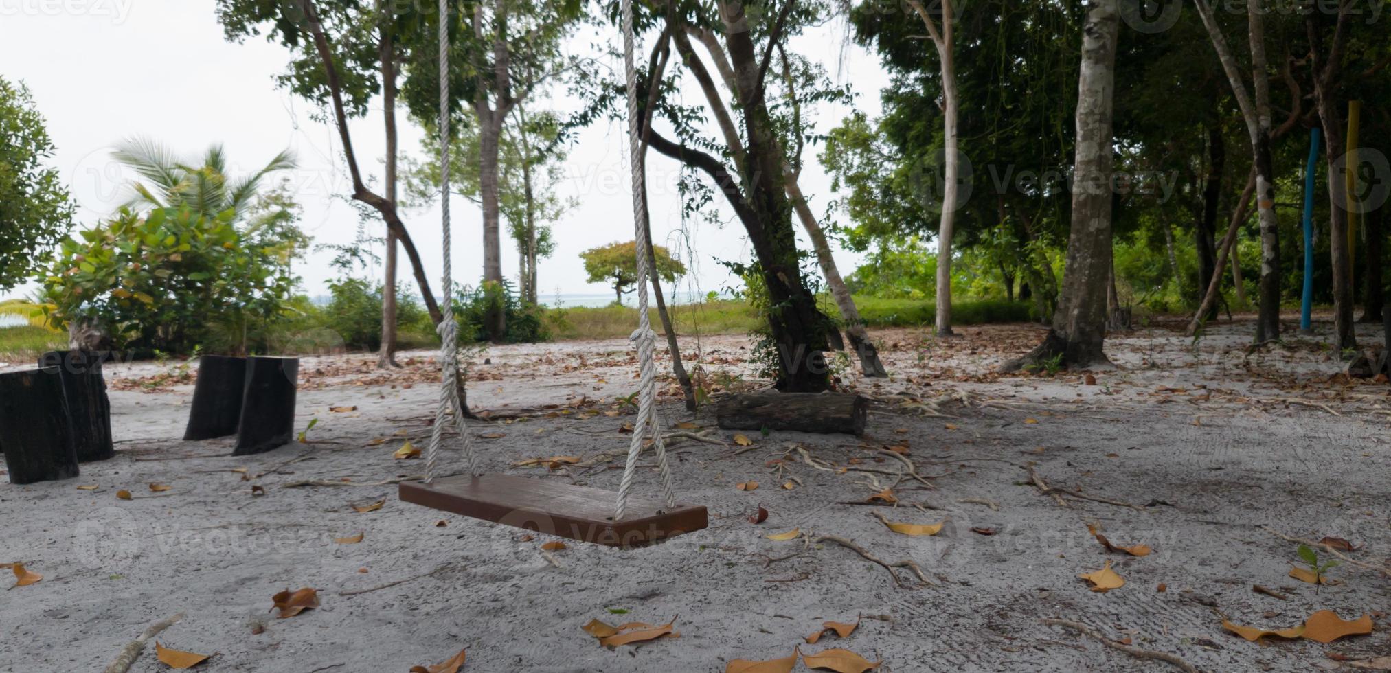 An empty cradle on the beach photo