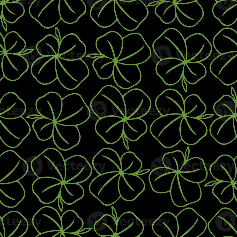 seamless symmetrical pattern of green quatrefoil clover on a black background, texture, design photo
