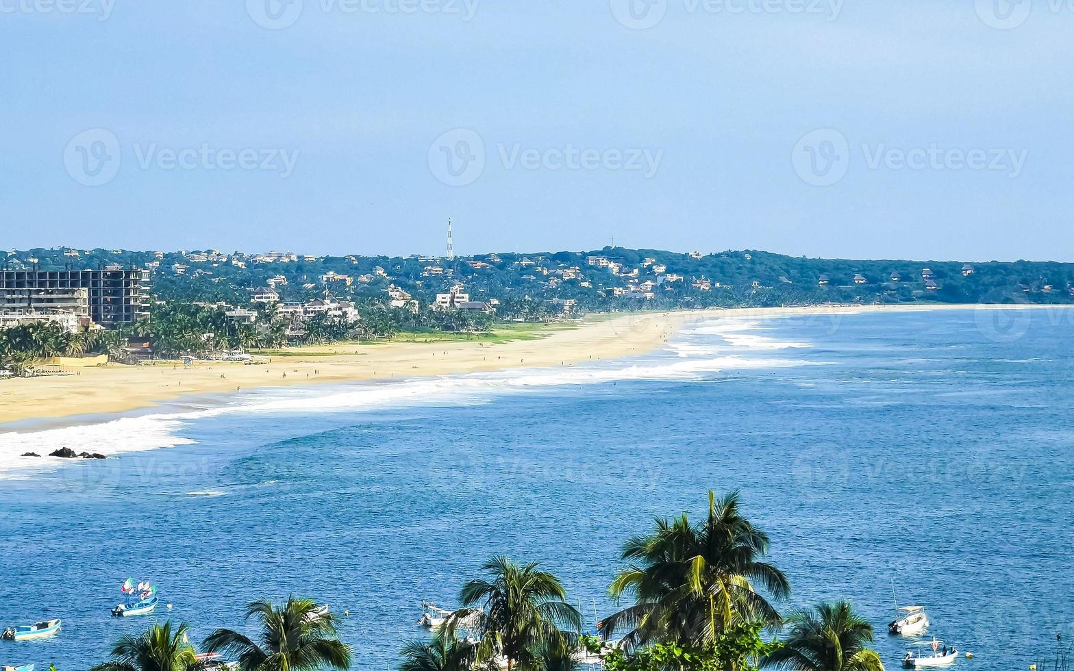 Beautiful natural panorama seascape palm trees beach Puerto Escondido Mexico. photo