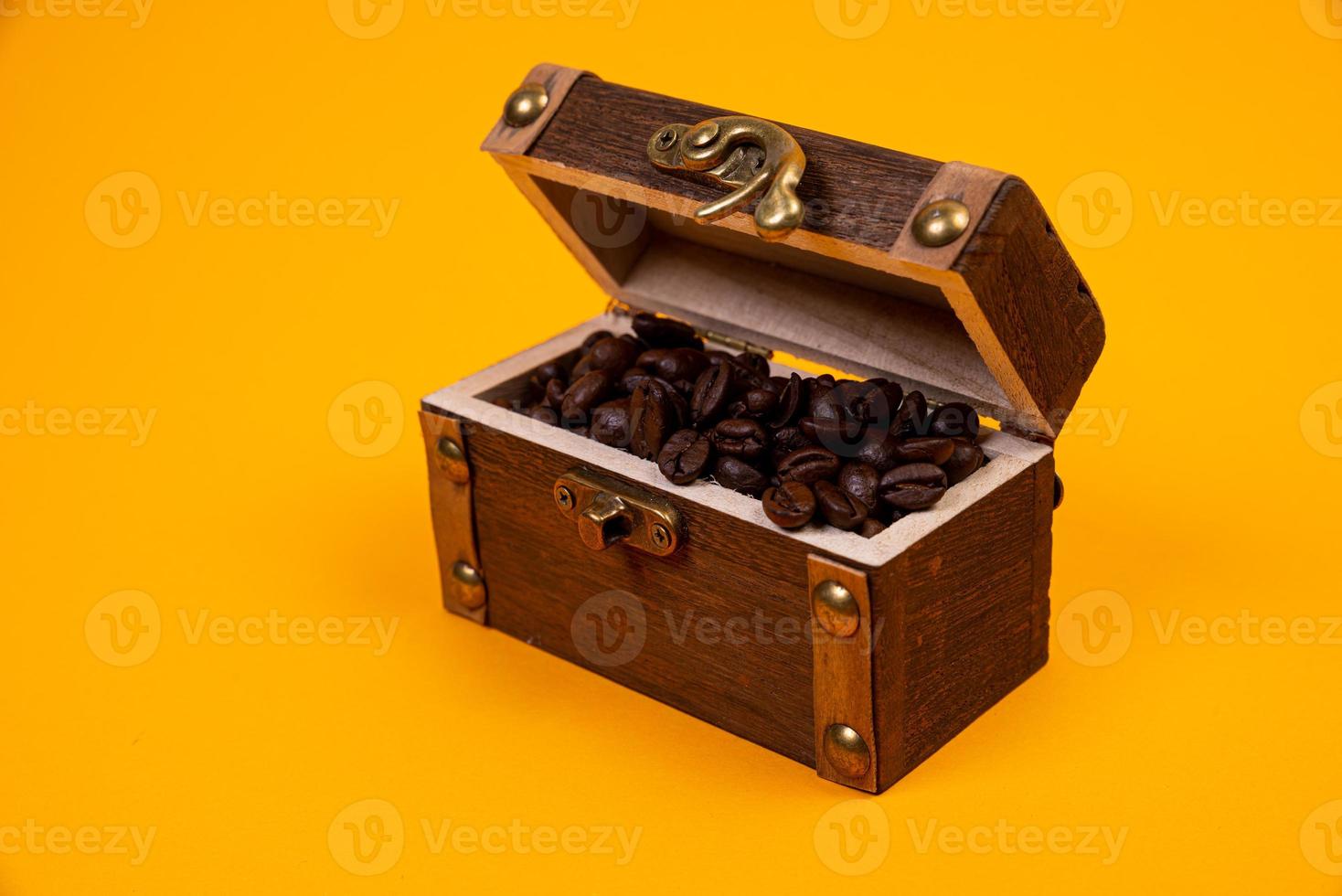 chest with coffee , Image of middle-aged coffee beans. Poured into a pirate chest. Precious, expensive, tonic, invigorating, fragrant, delicious, high-quality, roasted drink. Brown, photo