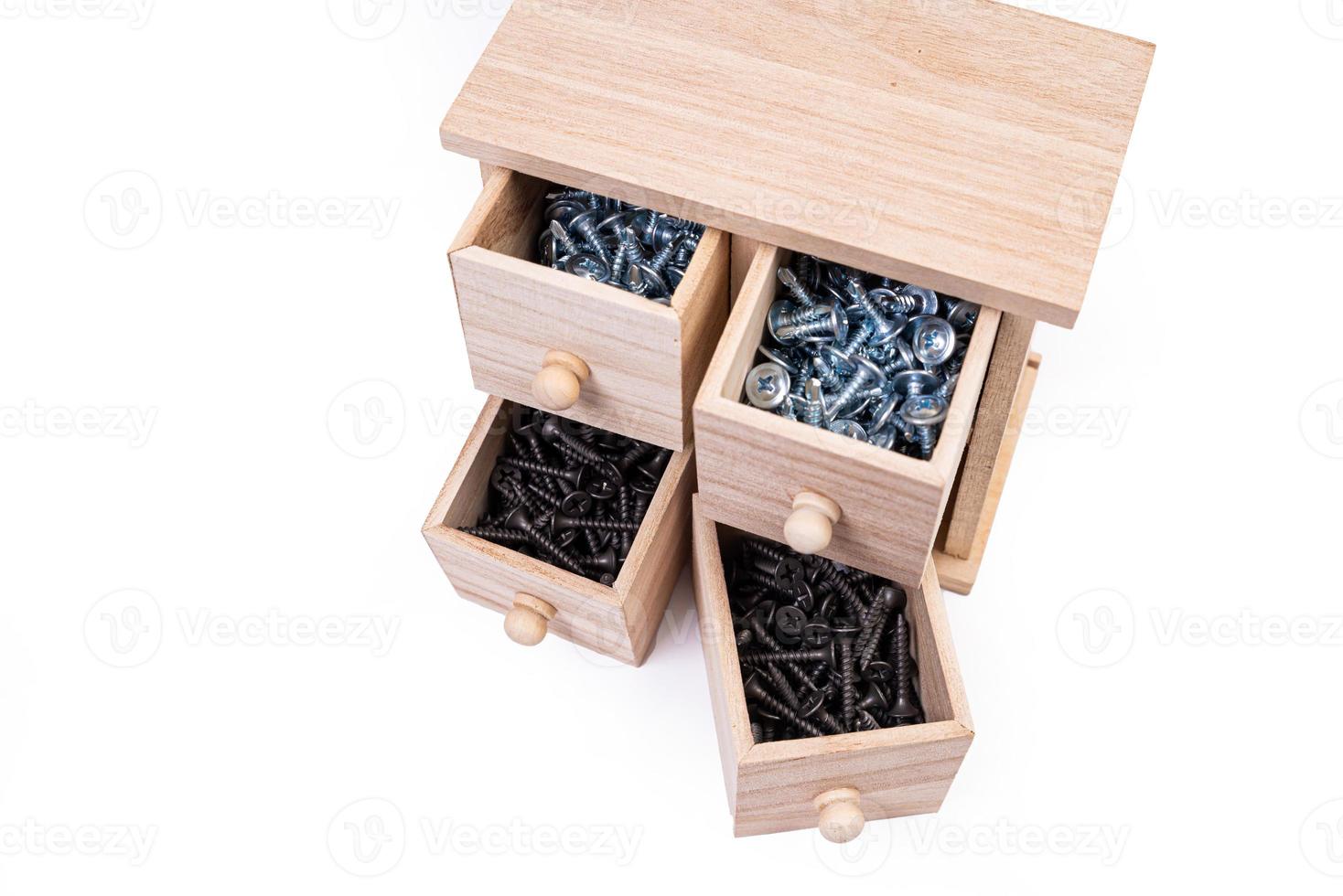 Wooden box for metal bolts, screws and nuts close up, metal self-tapping screws made of steel, self-tapping screw for metal, for iron, chrome-plated self-tapping screw, photo