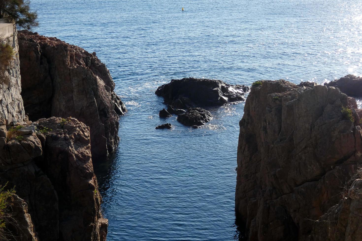 Rocks and sea in the catalan costa brava, mediterranean sea, blue sea photo