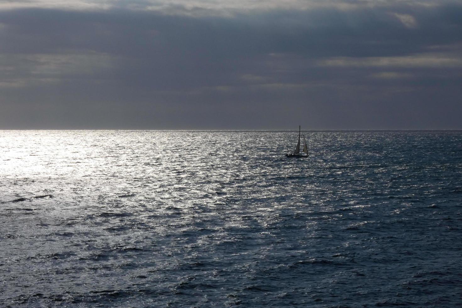 Sailboat sailing in the mediterranean sea, calm waters photo