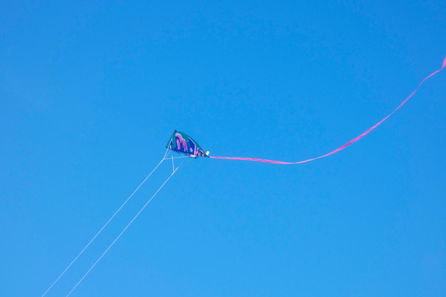 kite furrowing and hovering in the air under the blue sky photo