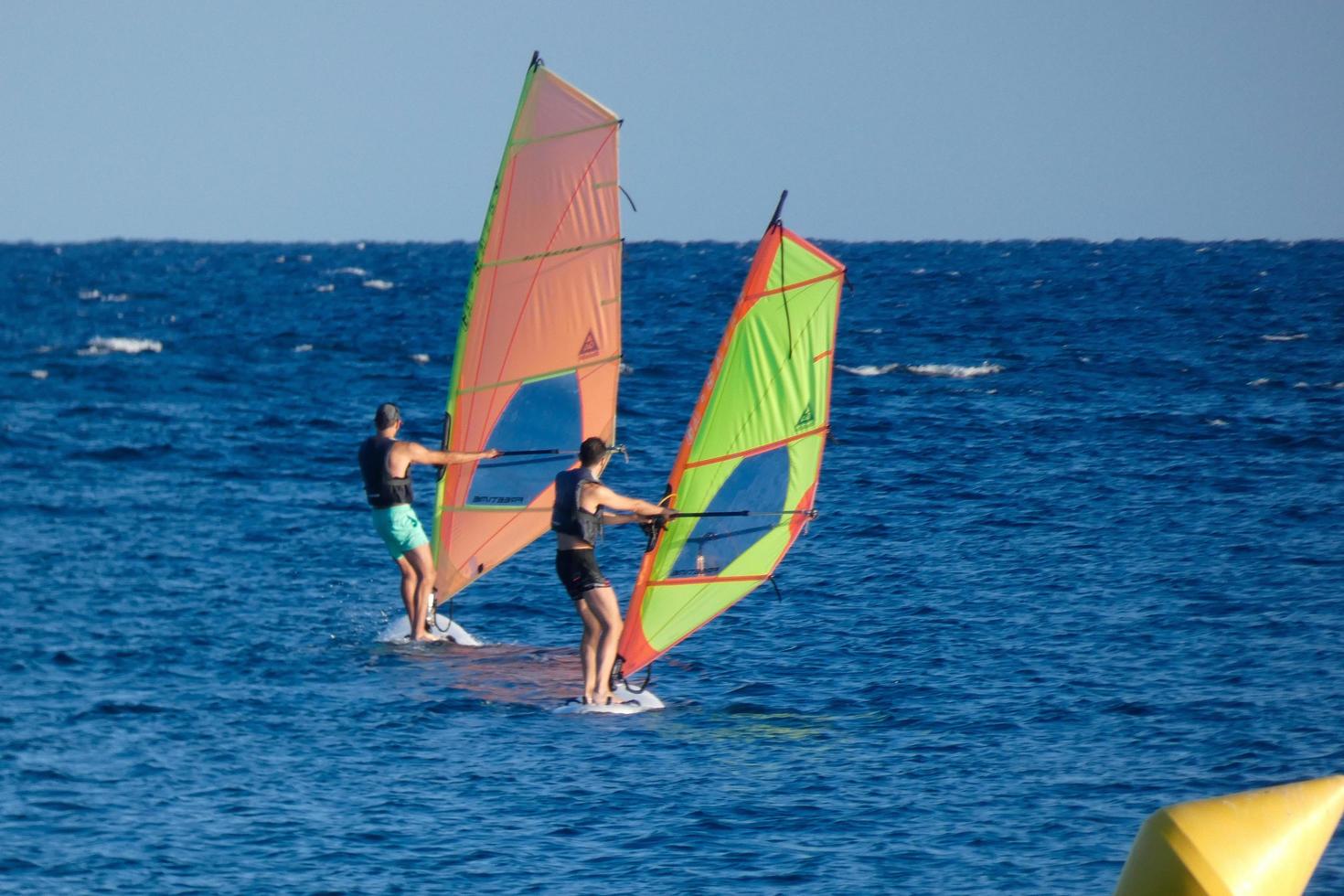 practicing windsurfing in the mediterranean sea, calm sea photo