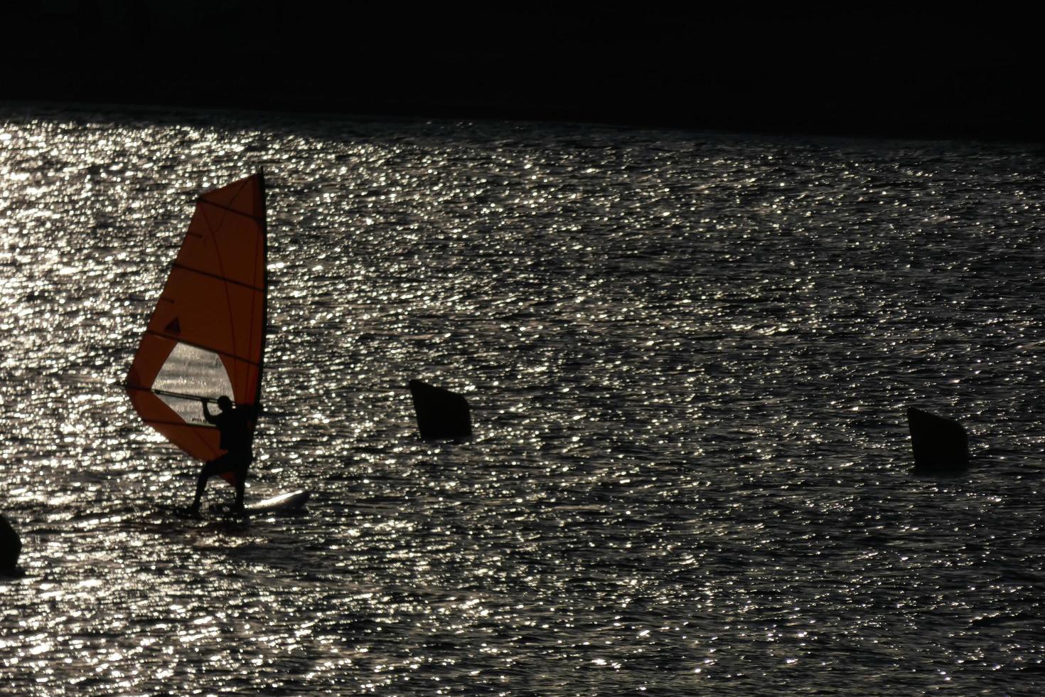 practicing windsurfing in the mediterranean sea, calm sea photo