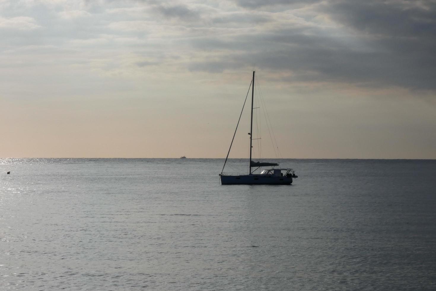 Sailboat sailing in the mediterranean sea, calm waters photo