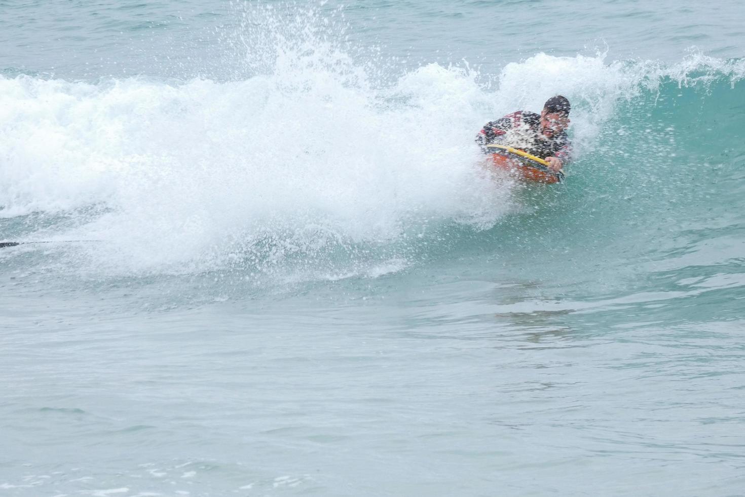 surfers taking advantage of small waves photo