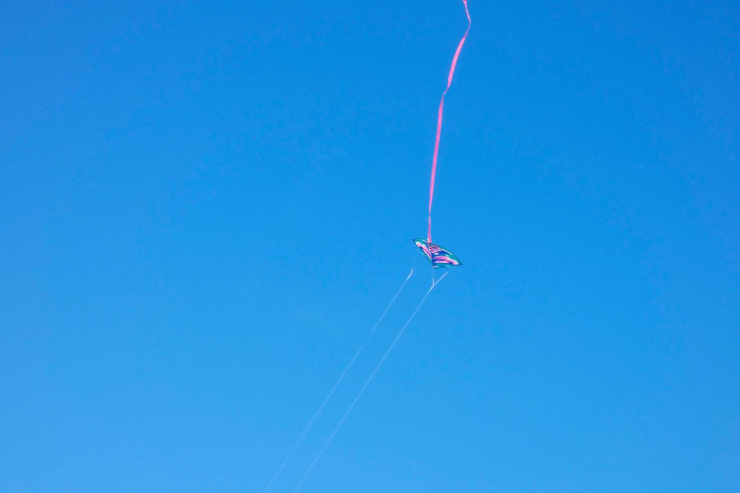 kite furrowing and hovering in the air under the blue sky photo