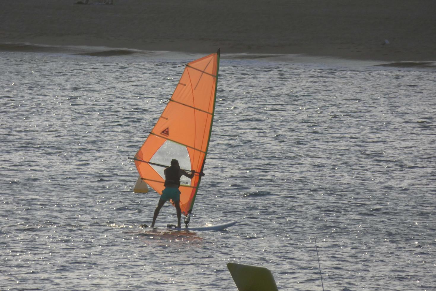 practicing windsurfing in the mediterranean sea, calm sea photo