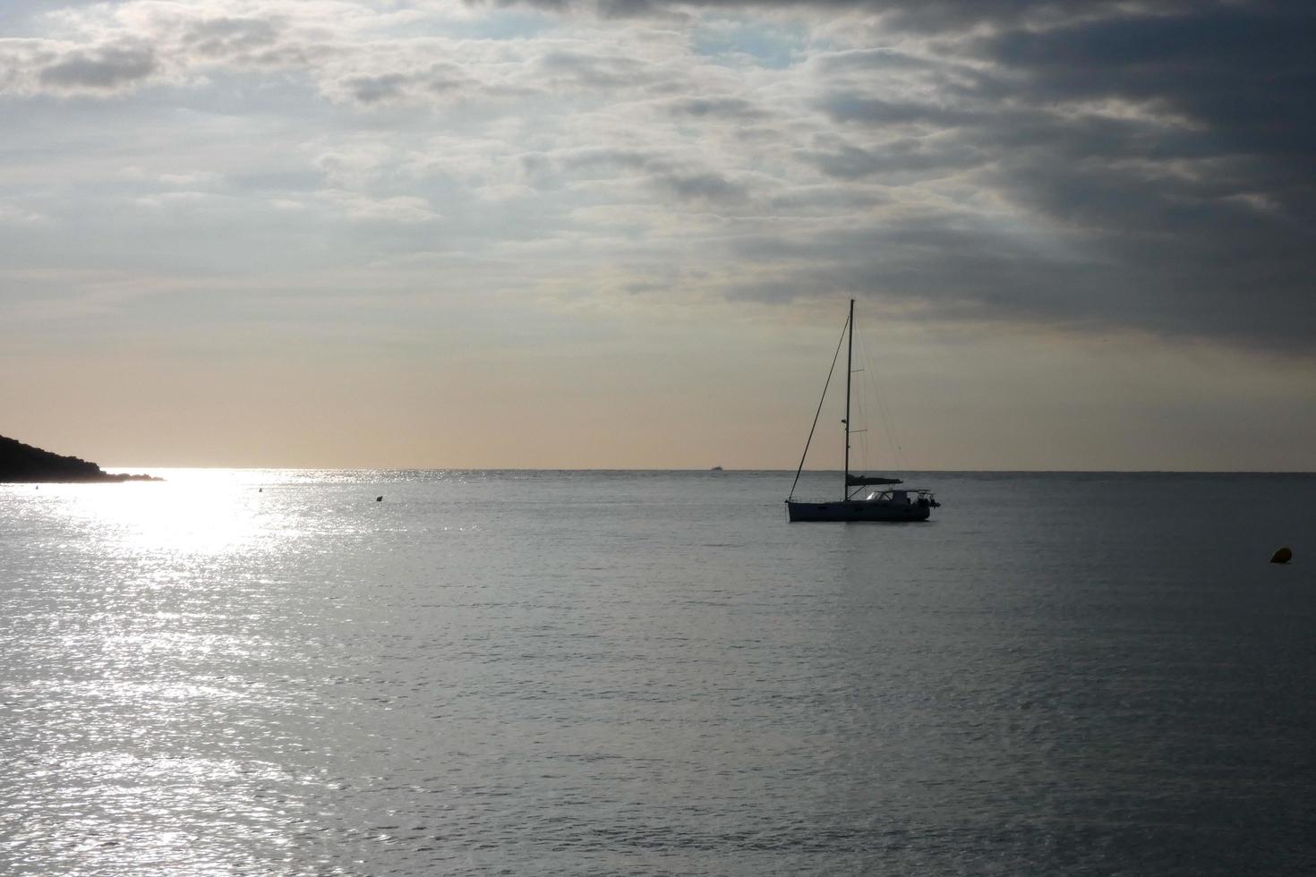 Sailboat sailing in the mediterranean sea, calm waters photo