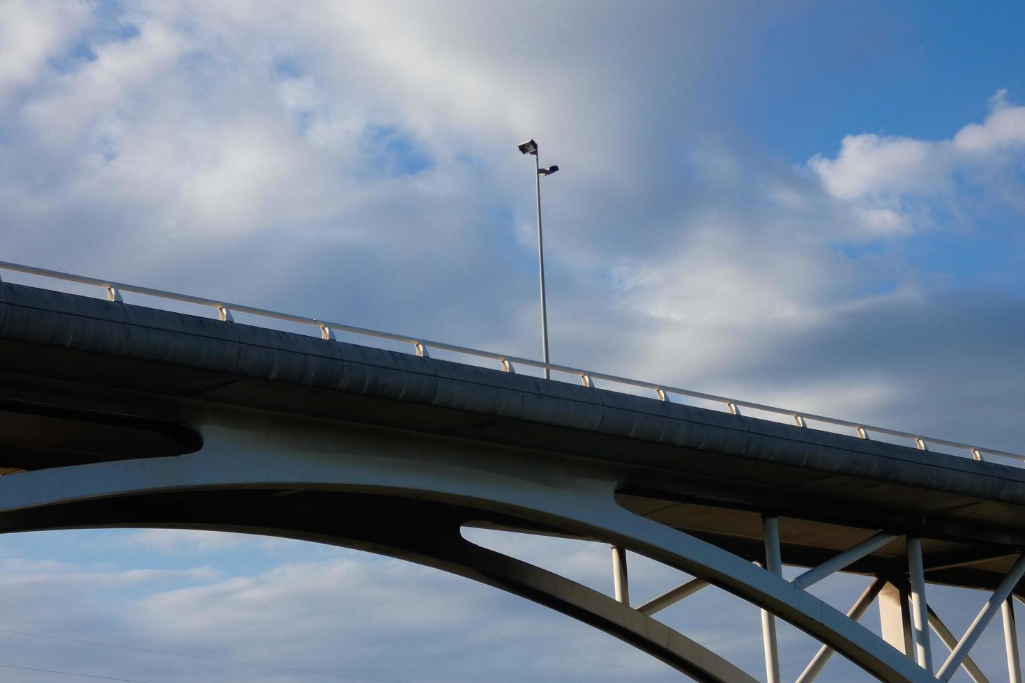 Arch of a modern bridge, engineering work photo