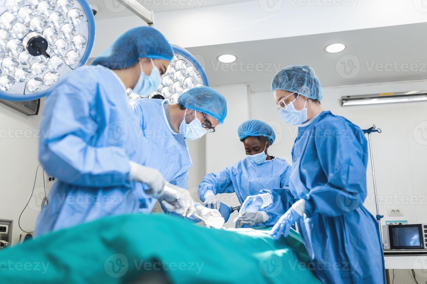 Doctor and assistant nurse operating for help patient from dangerous emergency case .Surgical instruments on the sterile table in the emergency operation room in the hospital.Health care and Medical photo