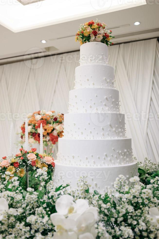 White wedding cake with flowers photo