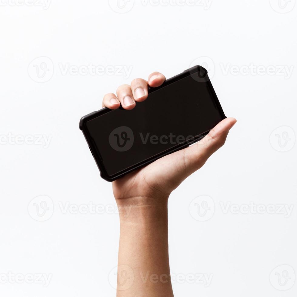 Asian person holding a mobile smartphone. photo