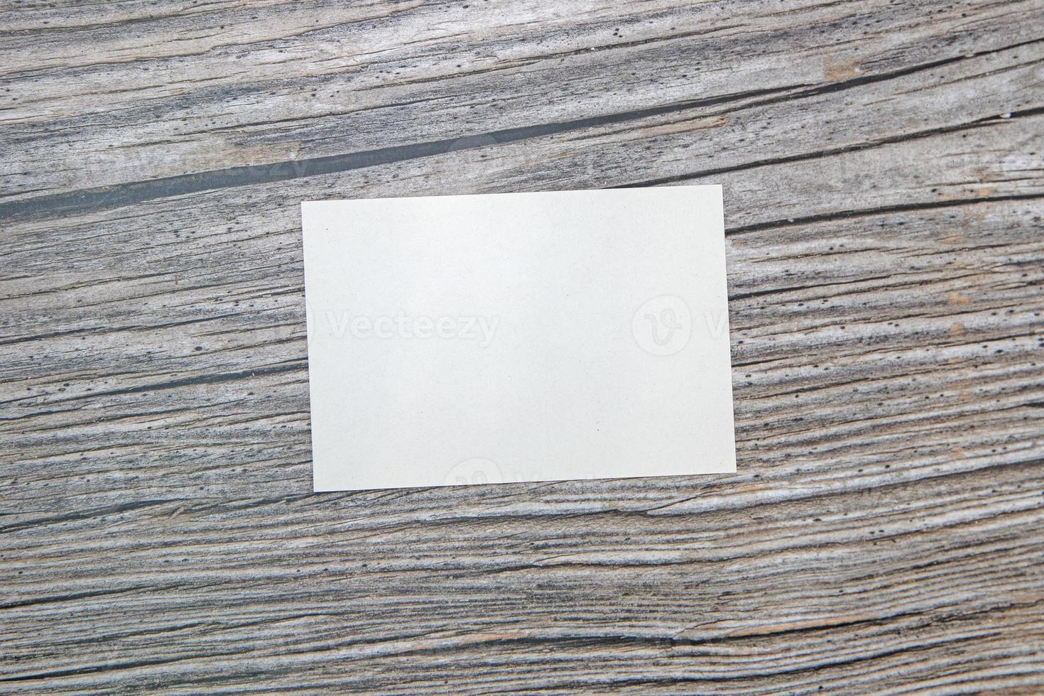 A5 paper greeting card mockup on wooden background photo