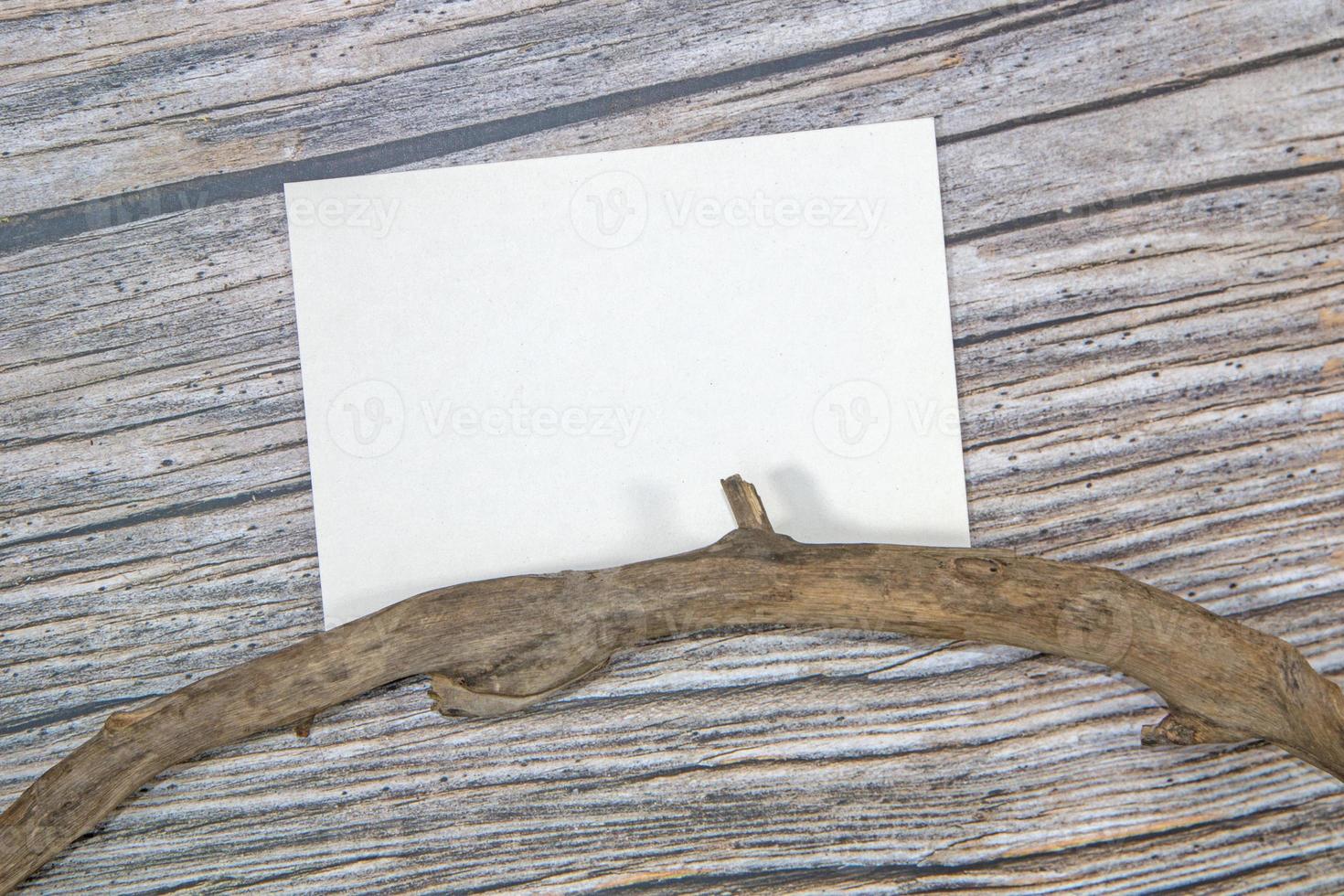 A5 paper greeting card mockup on wooden background photo