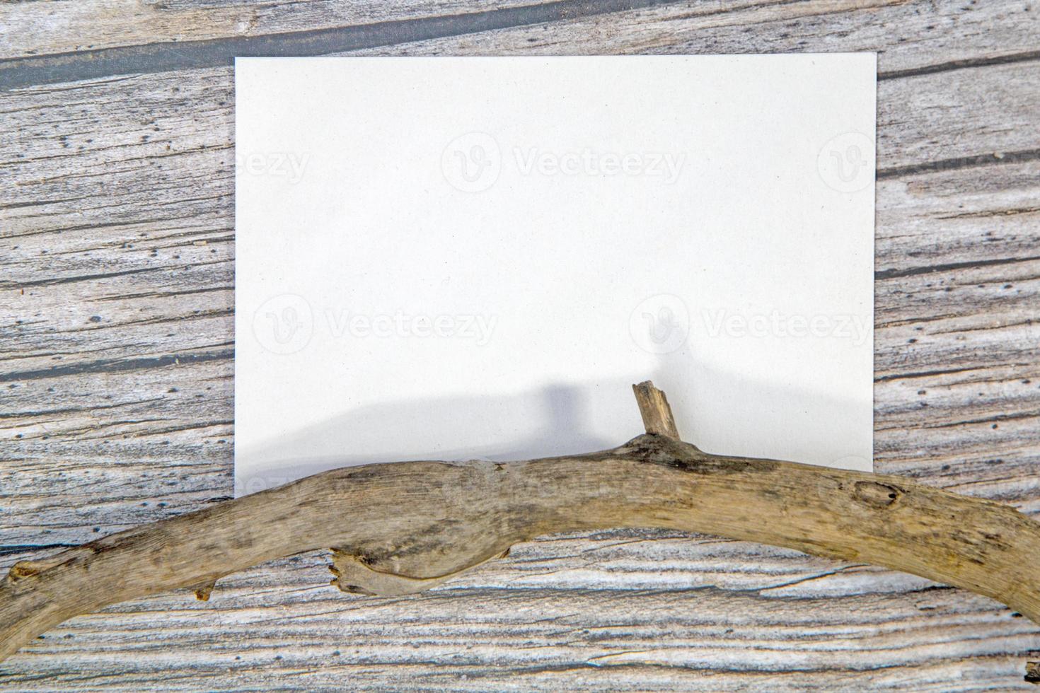 A5 paper greeting card mockup on wooden background photo