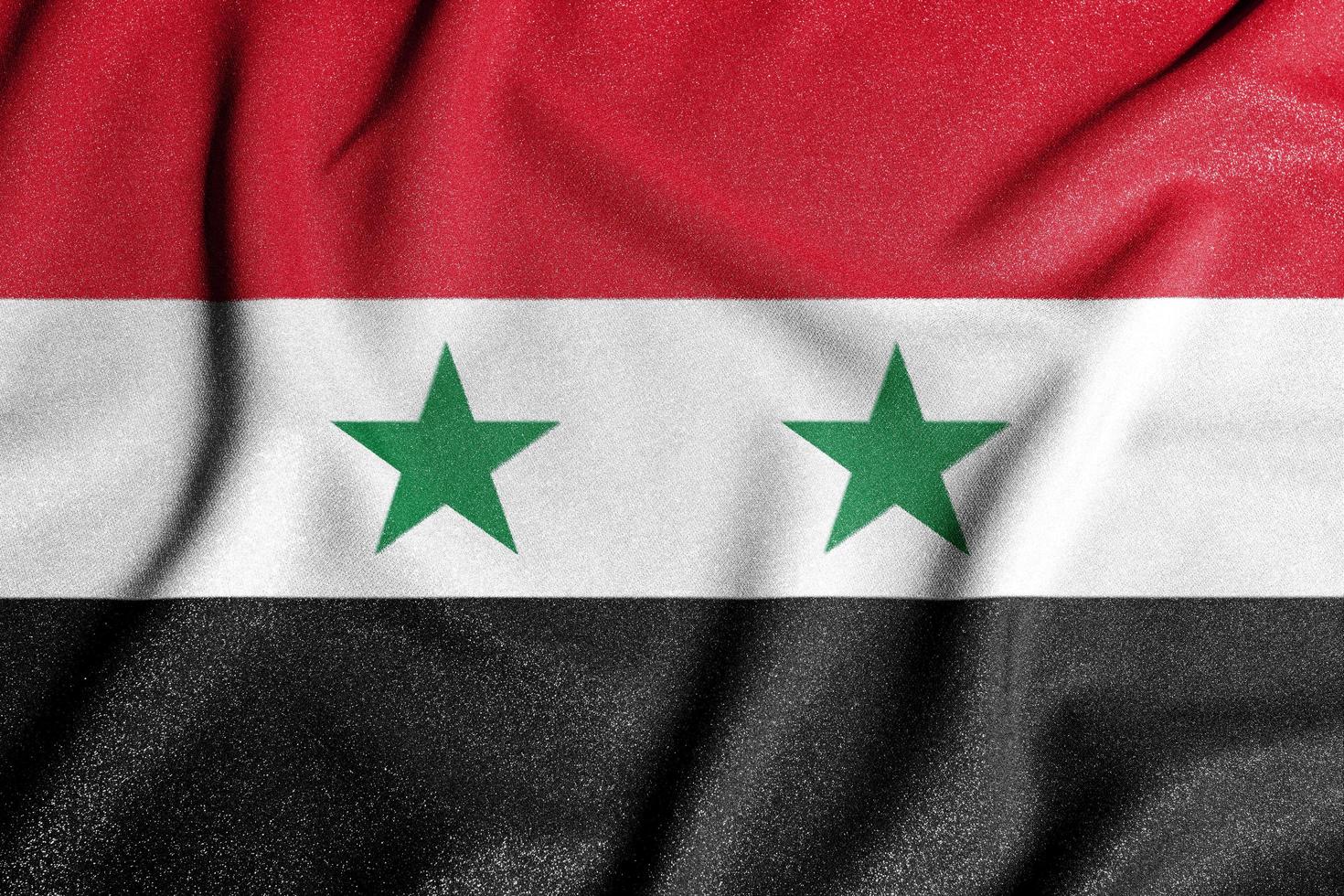 National flag of the Syria. The main symbol of an independent country. Flag of Syria. An attribute of the large size of a democratic state. photo