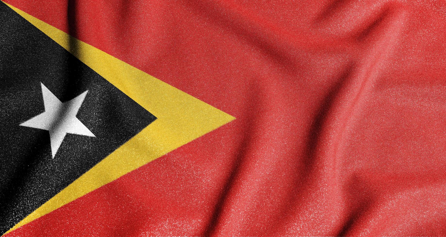 National flag of the east timor. The main symbol of an independent country. Flag of east timor. An attribute of the large size of a democratic state. photo