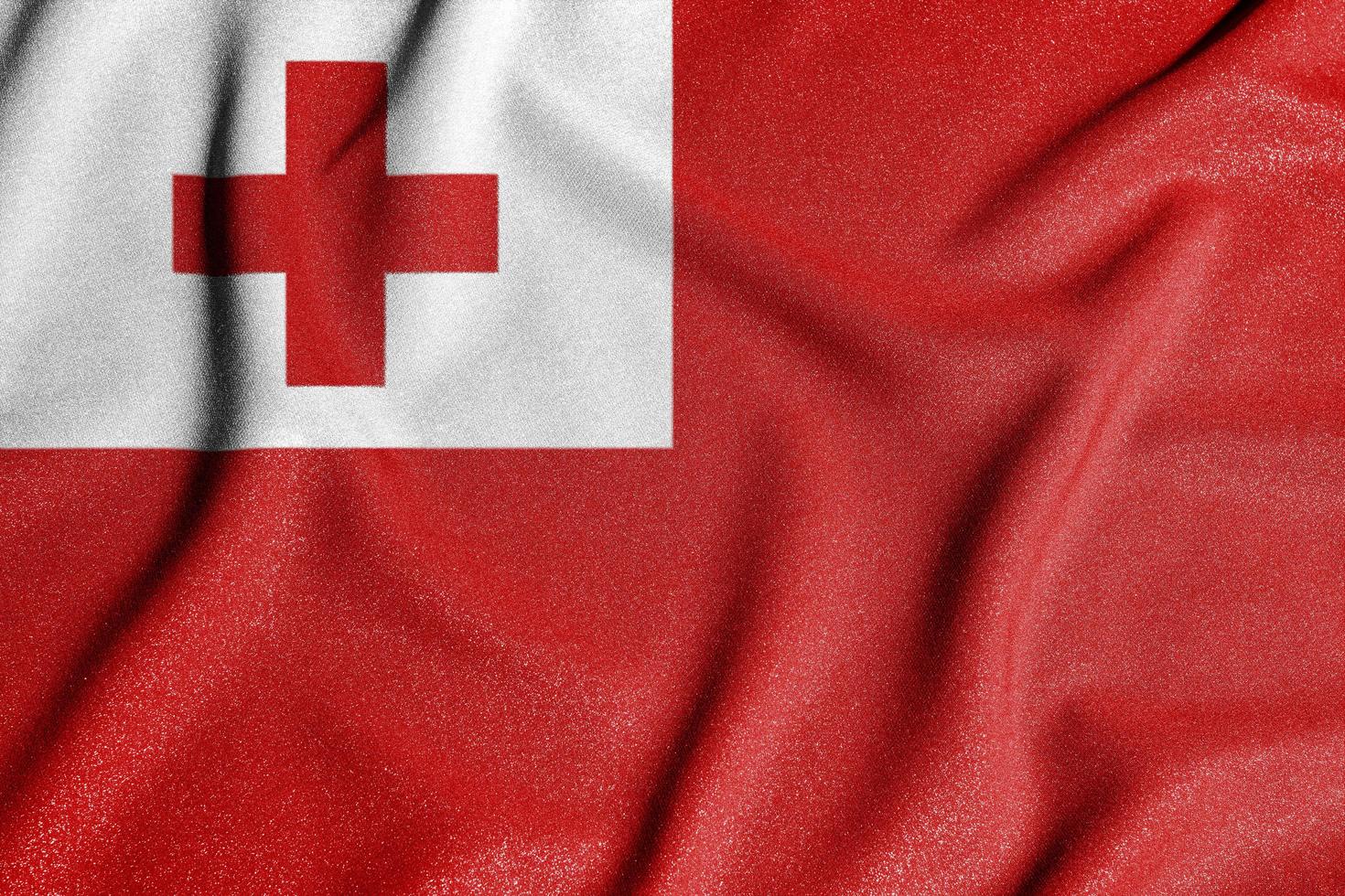 National flag of the tonga. The main symbol of an independent country. Flag of tonga. An attribute of the large size of a democratic state. photo