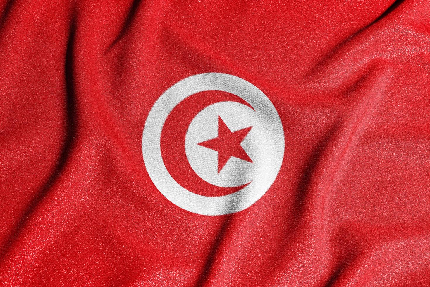 National flag of the Tunisia. The main symbol of an independent country. Flag of Tunisia. An attribute of the large size of a democratic state. photo