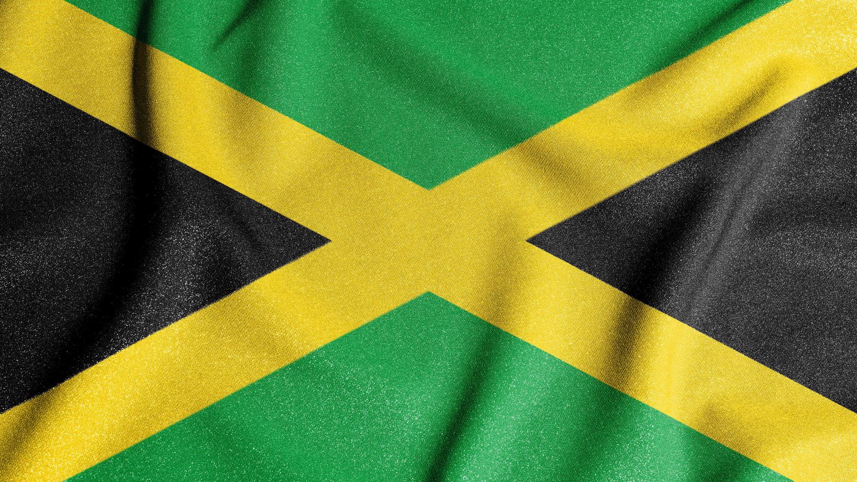National flag of the Jamaica. The main symbol of an independent country. Flag of Jamaica. An attribute of the large size of a democratic state. photo