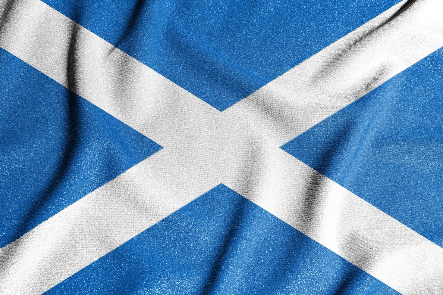 National flag of the Scotland. The main symbol of an independent country. Flag of Scotland. An attribute of the large size of a democratic state. photo