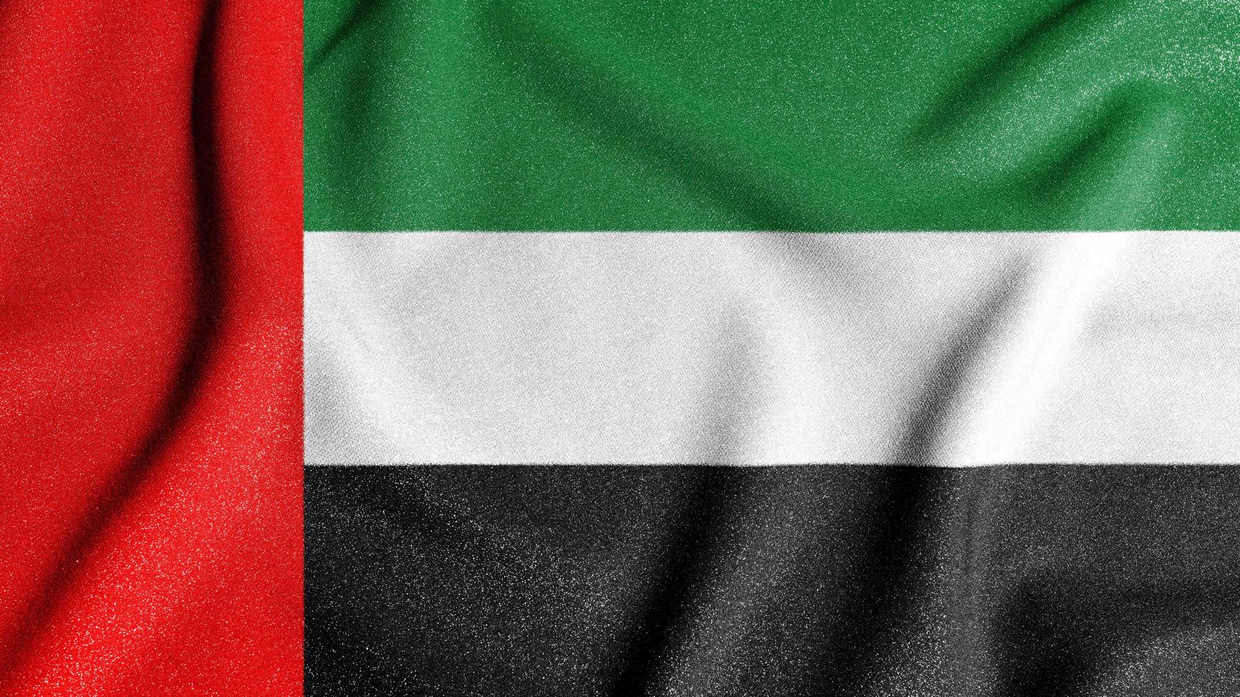bandera nacional de los emiratos árabes unidos. el principal símbolo de un país independiente. bandera de los emiratos árabes unidos. foto