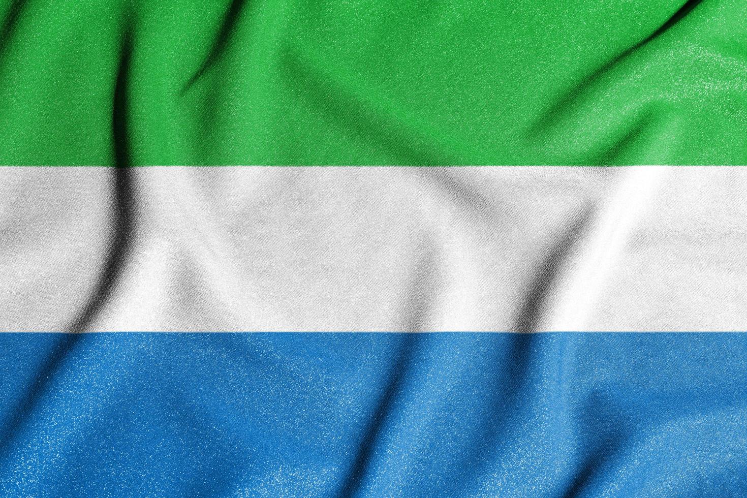 National flag of the Sierra Leone. The main symbol of an independent country. Flag of Sierra Leone. An attribute of the large size of a democratic state. photo