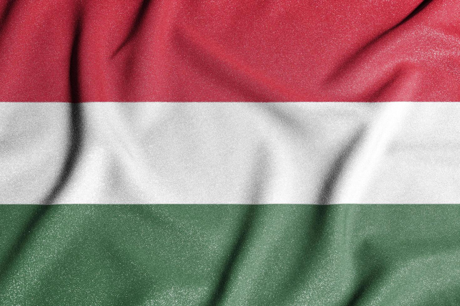 National flag of the Hungary. The main symbol of an independent country. Flag of Hungary. An attribute of the large size of a democratic state. photo