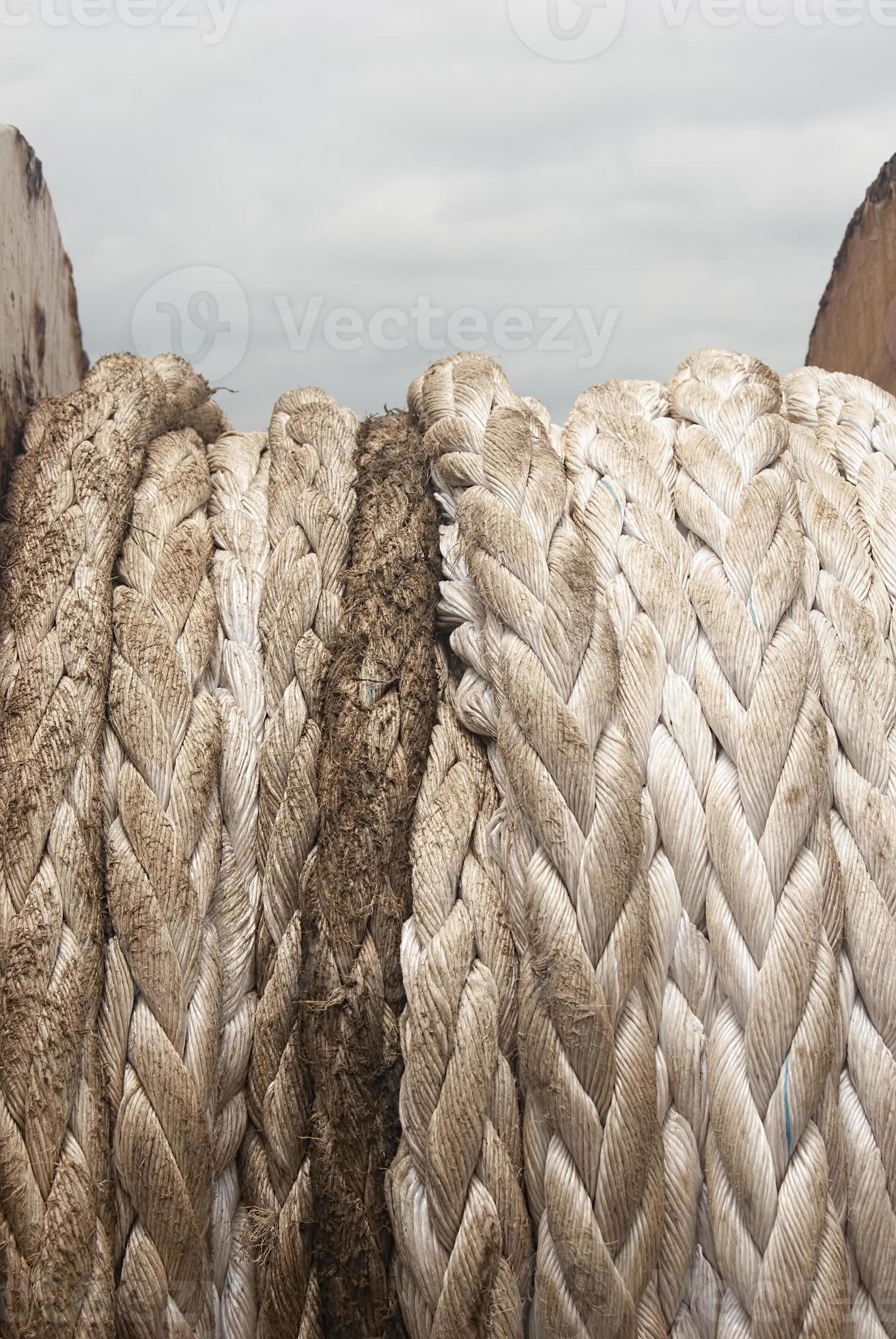 Old brown and gray frayed ship rope closeup. Classic texture