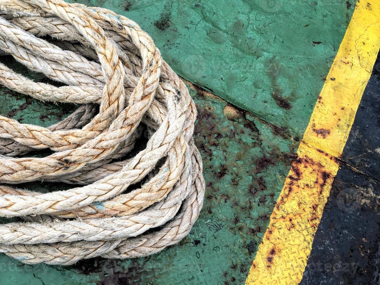 Old brown and gray frayed ship rope closeup. Classic texture. photo