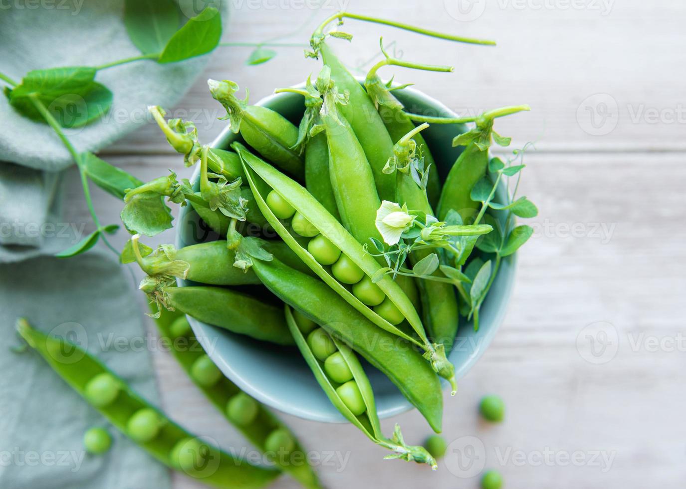 Bowl with sweet pea pods photo