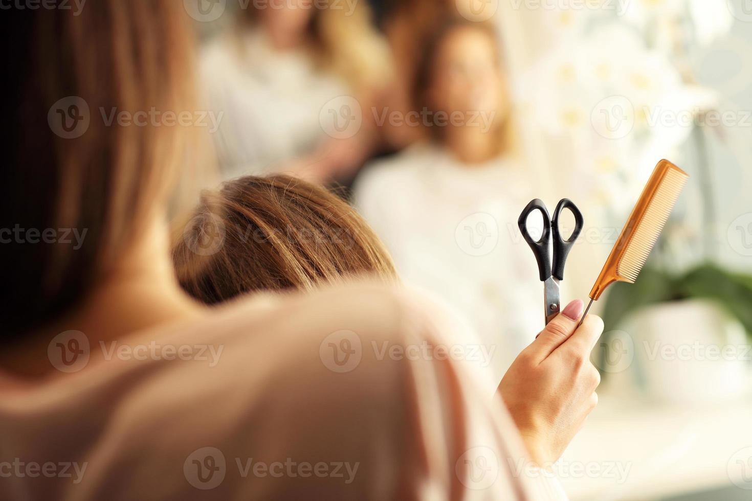 Hairdresser with scissors and comb photo