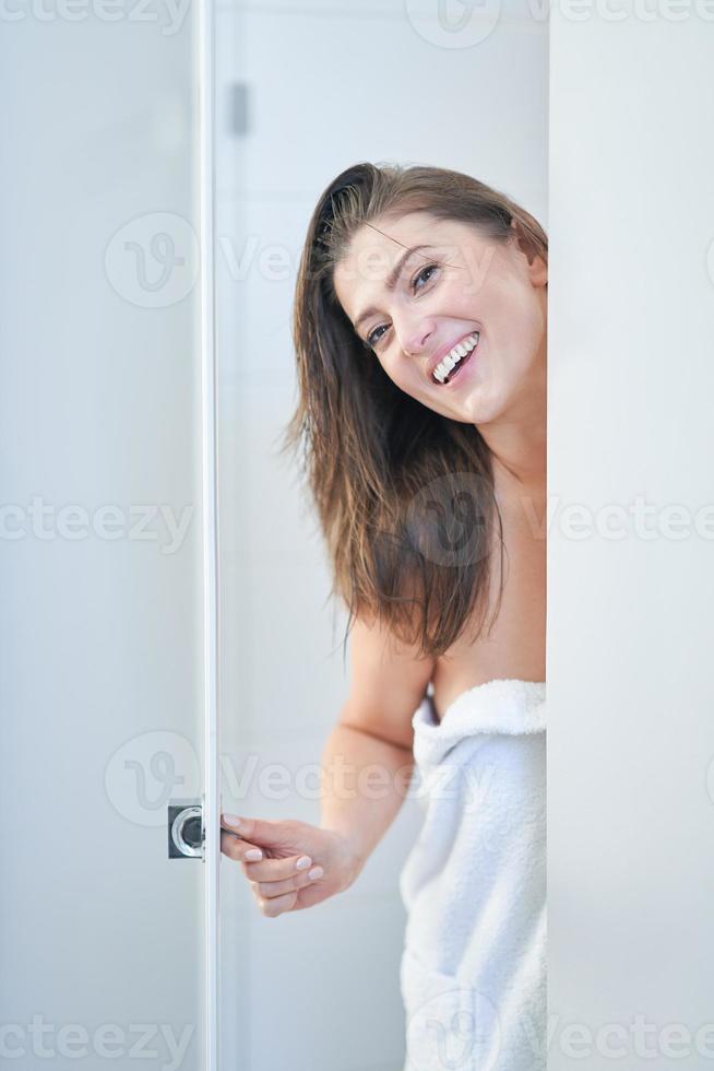 Young nice brunette woman in the bathroom photo
