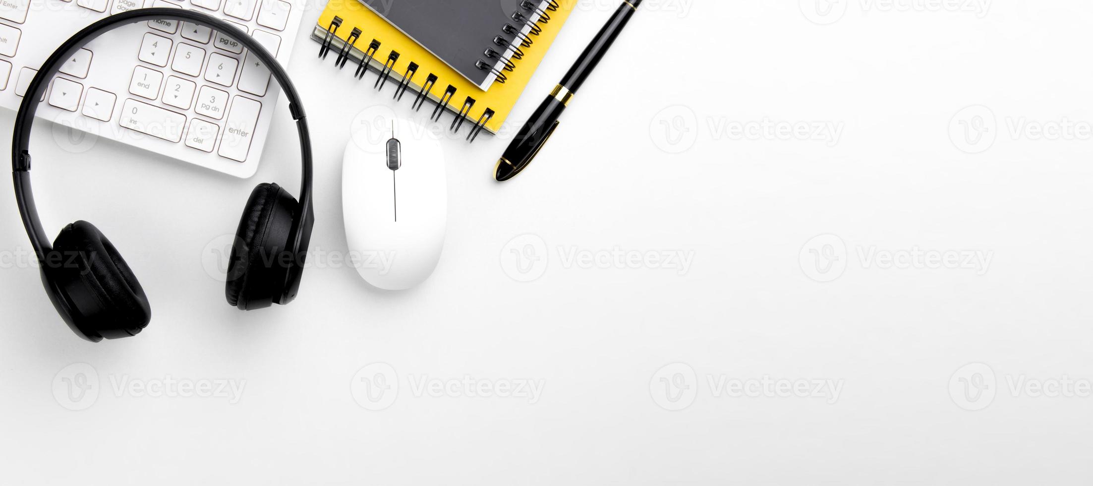 top view of modern white table with headset and computer keyboard on white background call center workspace concept, customer service, online meeting, workspace management style business design space photo