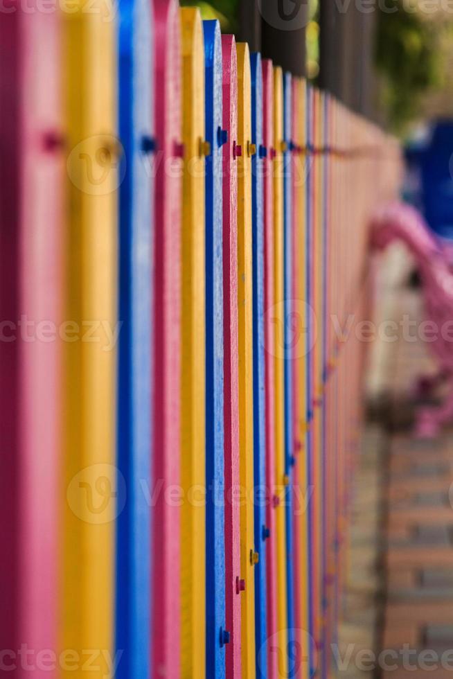 School fence made of plaswood with a steel structure in the background was created to be beautiful in a variety of colors in the imagination of children. It is a kind of work of art. photo