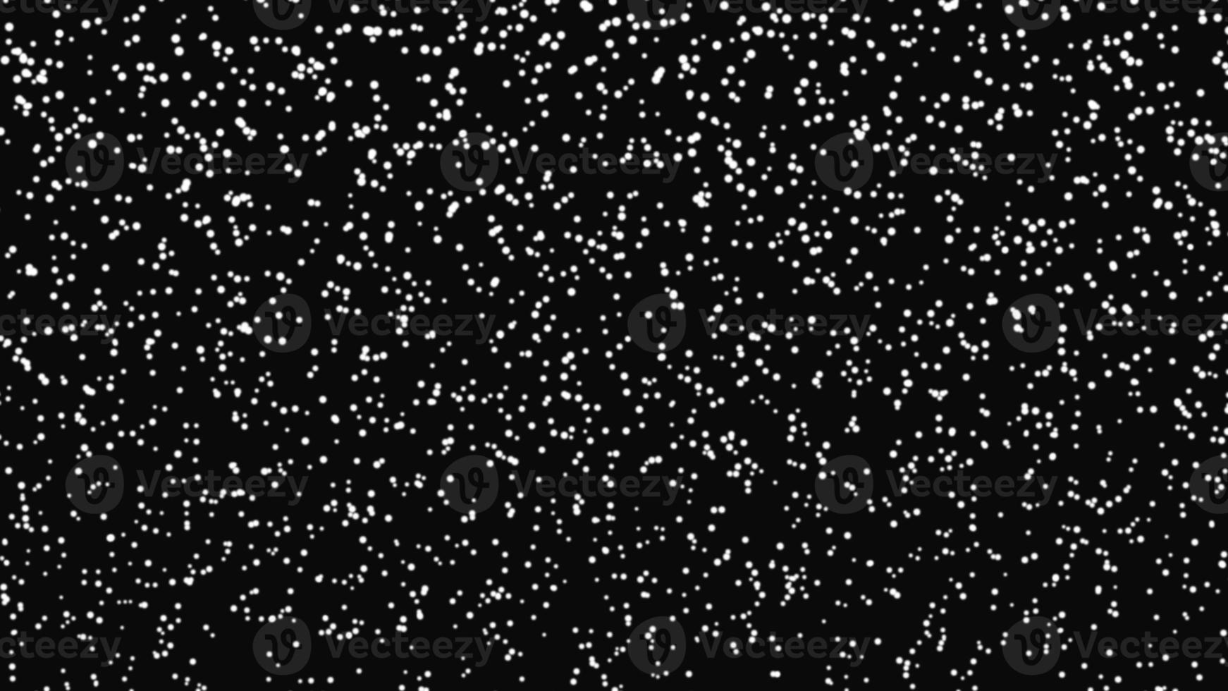 Snowfall bokeh on black background. Many snowflakes in flying in the air. Winte night snowfall and blizzard of snow at. Blur bokeh light effect creative background photo