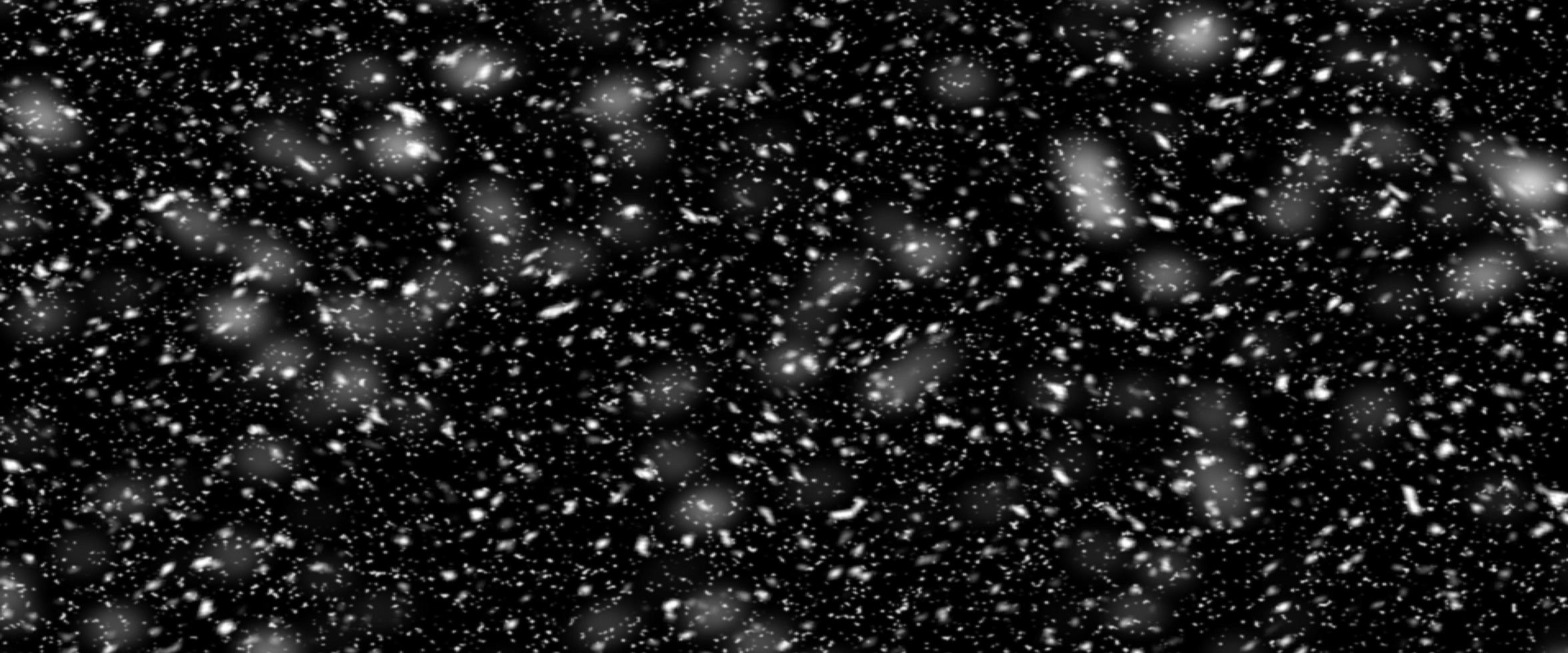 Falling snow isolated on black background. Falling snow at night. Bokeh lights on black background, flying snowflakes in the air. Winter weather. Overlay texture. photo